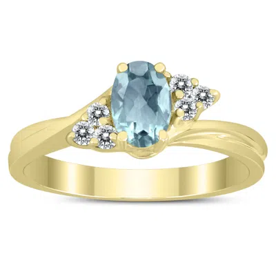 Sselects 6x4mm Aquamarine And Diamond Twist Ring In 10k Yellow Gold