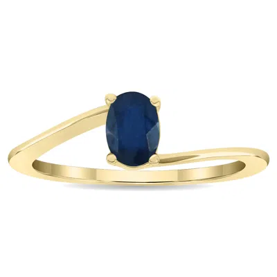 Sselects Women's Solitaire Oval Shaped Sapphire Wave Ring In 10k Yellow Gold