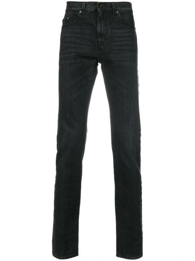 Saint Laurent Vintage Effect Distressed Jeans In Black