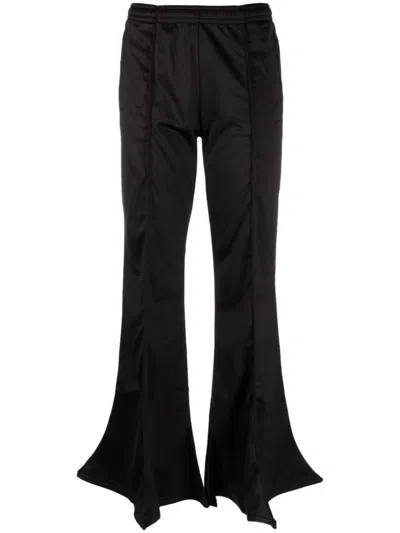 Y/project Flared Track Pants With Pleat Detailing And Asymmetric Hem In Black