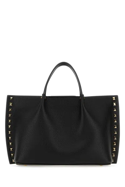 Valentino Garavani Handbags. In Black