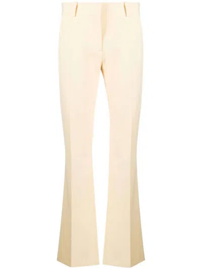 Frame Le Mini Boot Flared Trousers In Yellow