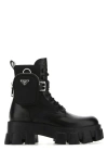 Prada Monolith Leather And Re-nylon Boots With Pouch In Black