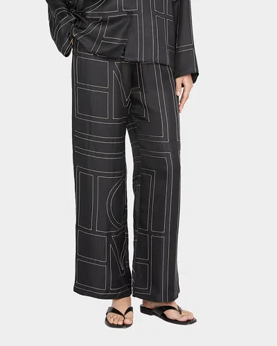 Totême Monogram-embroidered Silk Pyjama Trousers In Black