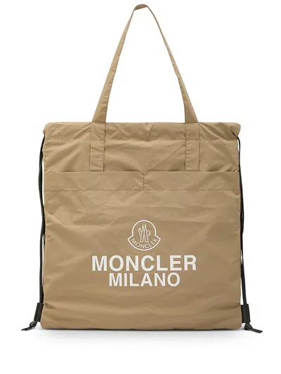 Moncler Logo Printed Drawstring Tote Bag In Beige