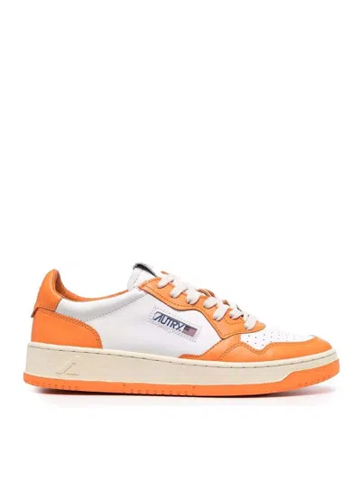 Autry Leather Trainers In Orange