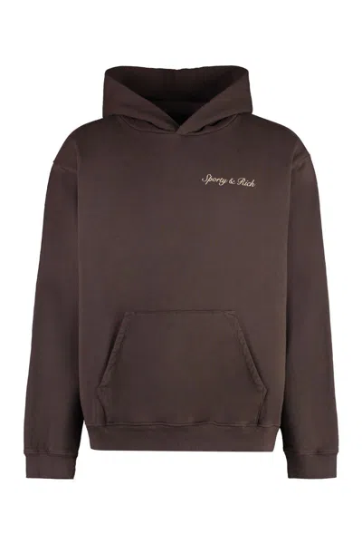 Sporty And Rich Sporty & Rich Logo Printed Long Sleeved Hoodie In Chocolate