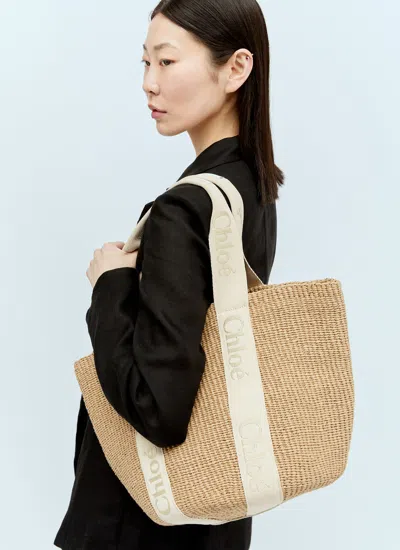 Chloé Woody Large Leather-trimmed Raffia Tote In Gold