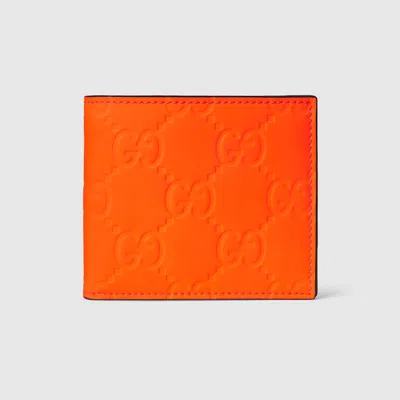 Gucci Gg Rubber-effect Bi-fold Wallet In Orange