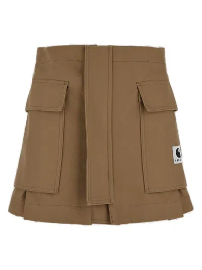 Sacai X Carhartt Wip Logo Patch Layered Shorts In Beige