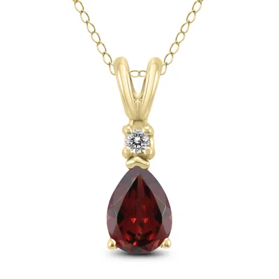 Sselects 14k 7x5mm Pear Garnet And Diamond Pendant In Red