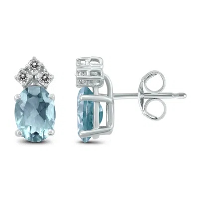 Sselects 14k 5x3mm Oval Aquamarine And Three Stone Diamond Earrings In Blue