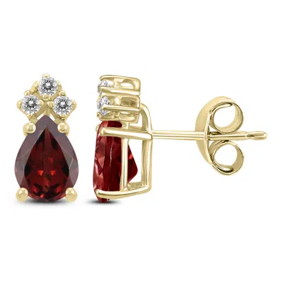 Sselects 14k 8x6mm Pear Garnet And Three Stone Diamond Earrings In Red