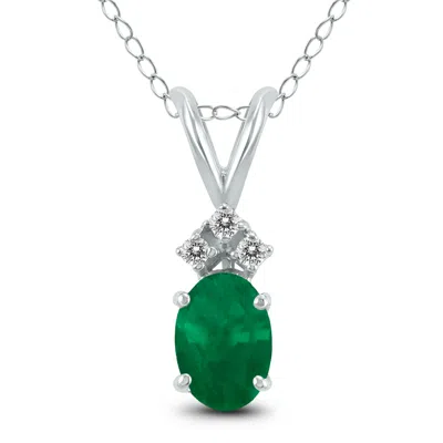 Sselects 14k 5x3mm Oval Emerald And Three Stone Diamond Pendant In Green