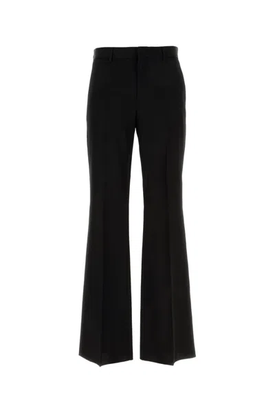 Versace Logo Patch Flared Trousers In Black