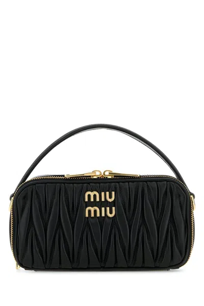 Miu Miu Handbags. In Black