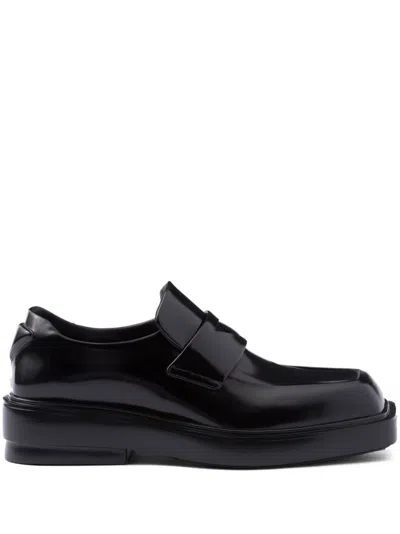 Prada Triangle-patch Leather Loafers In Black