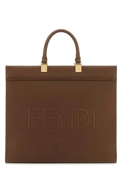 Fendi Handbags. In Brown
