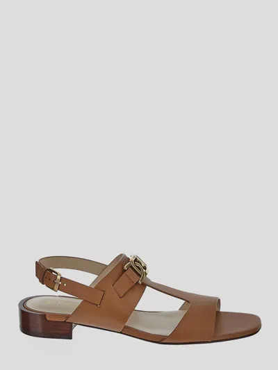 Tod's Logo Engraved Buckle Fastened Sandals In Brown