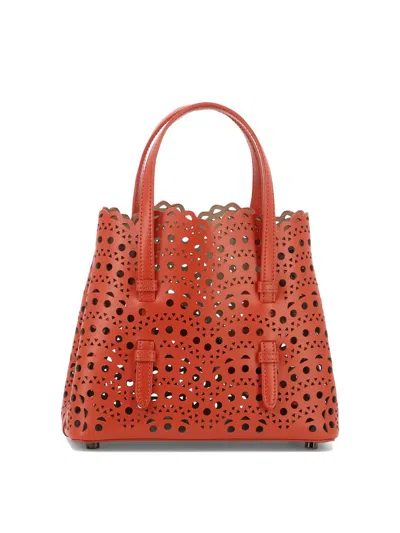 Alaïa Mina 20 Vienne Laser-cut Top-handle Bag In Red