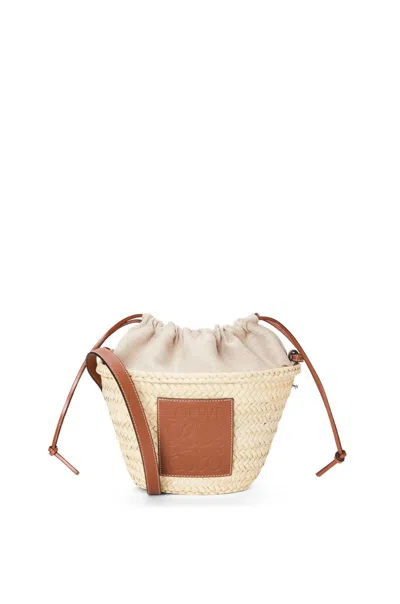 Loewe X Paula's Ibiza Woven Drawstring Bucket Bag In Tan