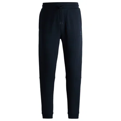 Hugo Boss Cotton-terry Tracksuit Bottoms With Logo Patch In Blue