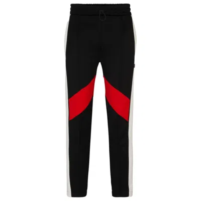 Hugo Relaxed-fit Tracksuit Bottoms With Color-blocking In Black