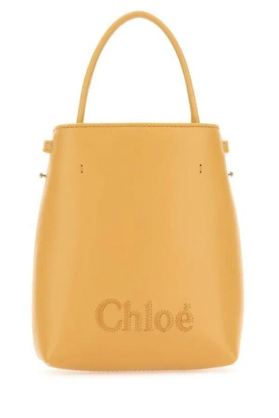 Chloé Sense Micro Leather Bucket Bag In Yellow