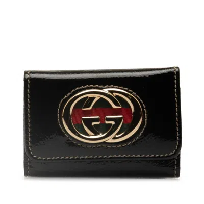 Gucci -- Black Patent Leather Wallet  ()