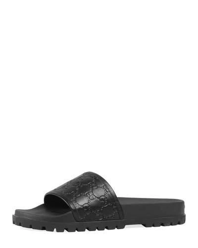 Gucci Gg Embossed Leather Slide Sandals In Black