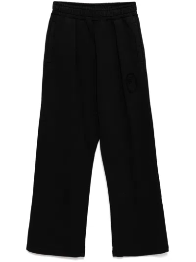 A Bathing Ape Garment-dye Track Trousers In Black