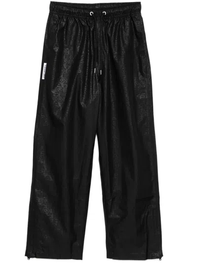 A Bathing Ape Hose Mit Monogramm-print In Schwarz