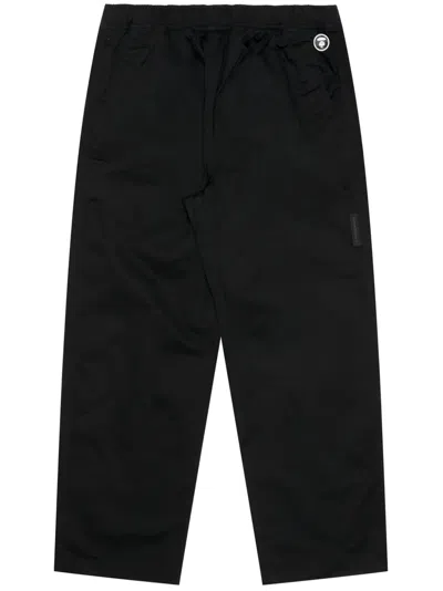 Aape By A Bathing Ape Logo-appliqué Cotton Trousers In Schwarz