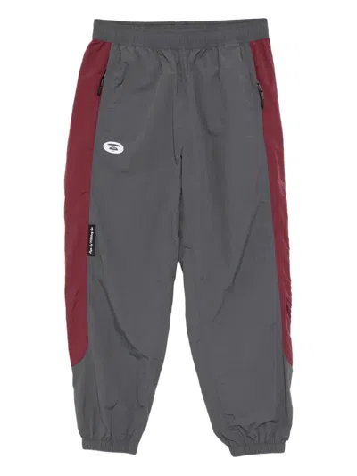 Aape By A Bathing Ape Logo-embroidered Trousers In Animal Print