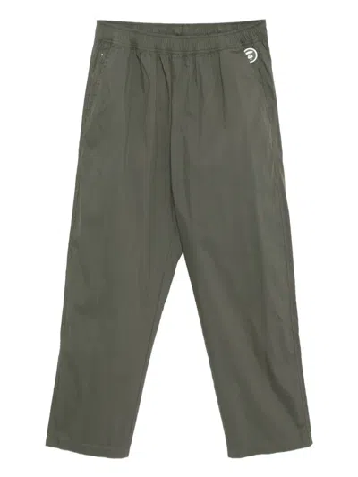 Aape By A Bathing Ape Logo-plaque Trousers In Green
