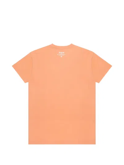 Aape By A Bathing Ape Moonface Logo-print T-shirt In Orange