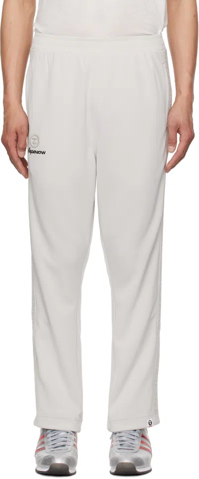 Aape By A Bathing Ape Off-white 'aape Now' Sweatpants In Gyr Grey (yellow)