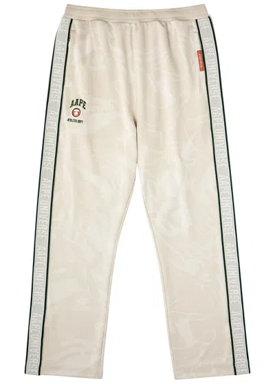 Aape Logo Camouflage-jacquard Jersey Track Pants In Beige