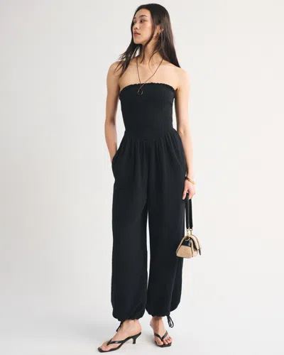 Abercrombie & Fitch A&f Sydney Smocked Strapless Balloon Leg Jumpsuit In Black