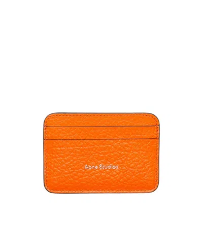 Acne Studios Embossed Logo Clip In Orange