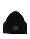 Acne Studios Pansy Face Ribbed Wool-blend Beanie In Black