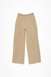 Acne Studios Logo Tape Trousers In Neutral