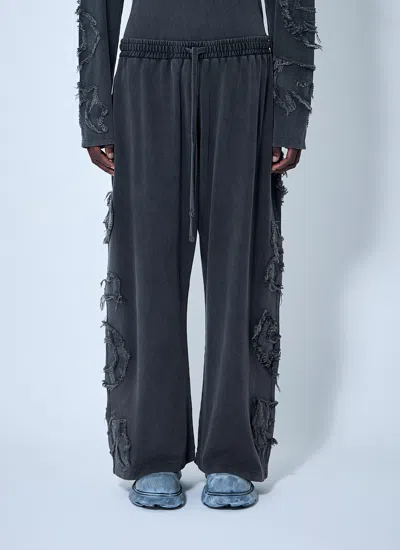 Acne Studios Men Distressed Logo Track Pants In Black