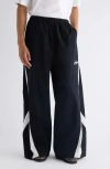Acne Studios Color-blocked Piping Casual Pants In Black