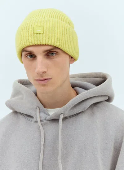Acne Studios Small Face Logo Beanie Hat In Yellow