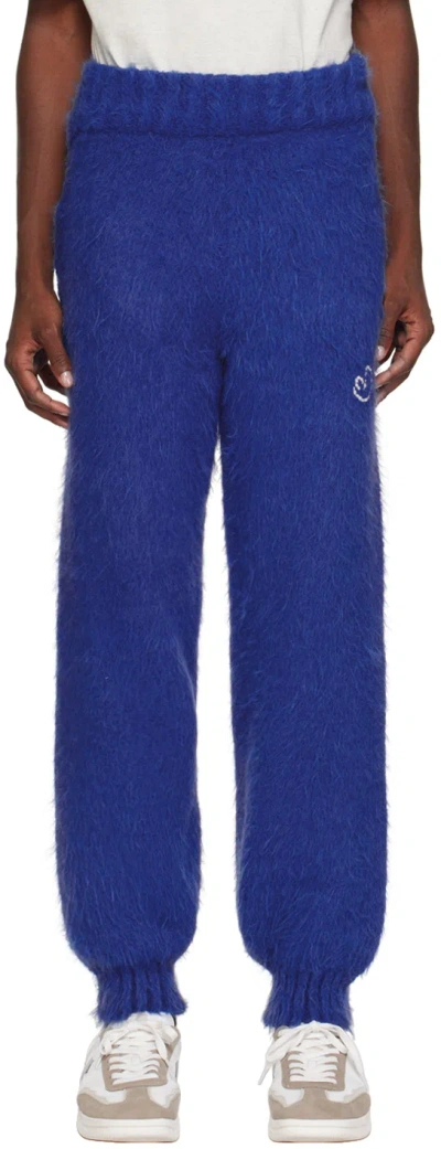 ADER ERROR BLUE DISTRESSED SWEATPANTS