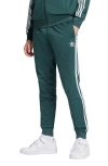 Adidas Originals Straight Trousers With Elastic Waistband And Side Stripes In Mineral Green