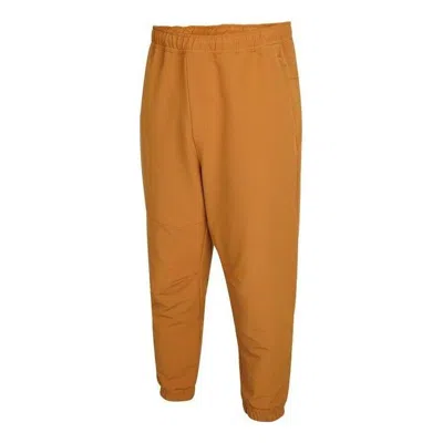 Adidas Originals Adidas Tech Comm Woven Pants 'brown' In Yellow