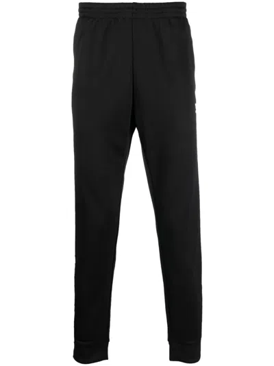Adidas Originals Embroidered-logo Tapered Track Pants In Black/betsca