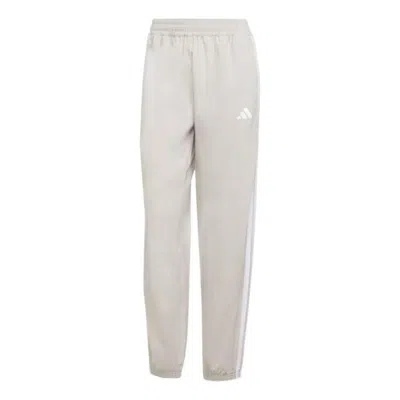 Adidas Originals (wmns) Adidas Train Essentials 3 Stripes Woven Pants 'beige White' In Gray